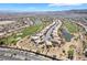 Beautiful aerial view of the community with golf course, homes, and landscaping at 4963 Pensier St, Las Vegas, NV 89135