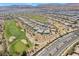 Gorgeous aerial view of the homes and golf course in a well-maintained community at 4963 Pensier St, Las Vegas, NV 89135