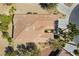 An overhead shot of a single Gathering home with mature landscaping and a tile roof in a desert community at 4963 Pensier St, Las Vegas, NV 89135