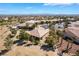 Birds eye view of a single Gathering home with desert landscaping, a tile roof, and a covered patio at 4963 Pensier St, Las Vegas, NV 89135