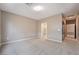 Neutral bedroom showcasing soft carpet, ample space, and a walk-in closet at 4963 Pensier St, Las Vegas, NV 89135