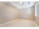 Tiled bedroom with a modern ceiling fixture and window that provides natural light at 4963 Pensier St, Las Vegas, NV 89135