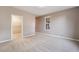 Spacious carpeted bedroom with a walk-in closet and window providing natural light at 4963 Pensier St, Las Vegas, NV 89135