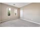 Bedroom with two windows offers abundant natural light and neutral carpet at 4963 Pensier St, Las Vegas, NV 89135