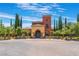 Community clubhouse featuring an inviting entrance and attractive landscaping at 4963 Pensier St, Las Vegas, NV 89135