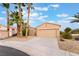 Lovely home with a two-car garage, desert landscaping, and a welcoming entrance at 4963 Pensier St, Las Vegas, NV 89135