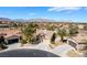 Desirable single-story home featuring desert landscaping, mature palm trees, two-car garage, and mountain views at 4963 Pensier St, Las Vegas, NV 89135