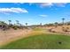Scenic golf course view with lush green fairways and desert landscape, set against a backdrop of mountains at 4963 Pensier St, Las Vegas, NV 89135