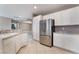 Bright kitchen featuring white cabinets and stainless steel appliances at 4963 Pensier St, Las Vegas, NV 89135