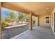 Covered patio with concrete flooring and desert landscaping offering a relaxing outdoor space at 4963 Pensier St, Las Vegas, NV 89135