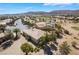 Aerial view of a single-story home, showcasing the desert landscaping and nearby mountains at 4963 Pensier St, Las Vegas, NV 89135