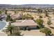 Rear exterior view of a single-story home with a tile roof and desert landscaping at 4963 Pensier St, Las Vegas, NV 89135