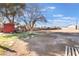 Large backyard with mature tree, shed, and potential for landscaping at 4970 E Van Buren Ave, Las Vegas, NV 89110