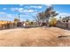 Large backyard featuring a shed, and mature shade trees at 4970 E Van Buren Ave, Las Vegas, NV 89110