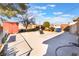 Spacious backyard features a large patio, shade trees, and storage shed at 4970 E Van Buren Ave, Las Vegas, NV 89110