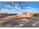 Large backyard with clear area, fenced perimeter, ready for new landscaping, outdoor activities, and entertainment at 4970 E Van Buren Ave, Las Vegas, NV 89110
