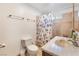 Well-lit bathroom with a shower-tub combo and vanity sink at 4970 E Van Buren Ave, Las Vegas, NV 89110