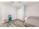 Bedroom with wood look flooring, ceiling fan and double closet at 4970 E Van Buren Ave, Las Vegas, NV 89110