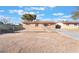 Cozy single-story home with a fenced front yard and desert landscaping, ready for personalized updates at 4970 E Van Buren Ave, Las Vegas, NV 89110