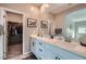 Bathroom featuring double sinks and a walk-in closet for ample storage at 524 Teovani St # 826, Henderson, NV 89052