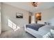 Bright bedroom featuring neutral walls and carpet, and an ensuite bathroom at 524 Teovani St # 826, Henderson, NV 89052