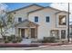 Charming townhome exterior with stone accents, private balcony, and well-maintained landscaping at 524 Teovani St # 826, Henderson, NV 89052