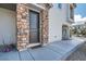 Inviting front entrance with a stone-framed doorway and a modern, stylish door at 524 Teovani St # 826, Henderson, NV 89052