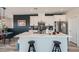 Elegant kitchen with stainless steel appliances, white cabinets, and a large center island with seating at 524 Teovani St # 826, Henderson, NV 89052