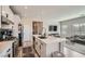 Modern kitchen features stainless steel appliances, quartz countertops, and an open layout at 524 Teovani St # 826, Henderson, NV 89052