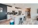 Bright kitchen boasts white cabinets, stainless steel appliances, and a large island with seating at 524 Teovani St # 826, Henderson, NV 89052
