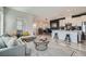 Open-concept living room with a modern kitchen and dining area, perfect for entertaining at 524 Teovani St # 826, Henderson, NV 89052