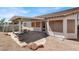 Backyard featuring a covered patio, concrete slab, desert landscaping, and above ground pool at 531 Coolidge Ave, Henderson, NV 89015