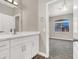 Bathroom features a vanity with drawers and cabinets, light fixture and view into bedroom at 531 Coolidge Ave, Henderson, NV 89015