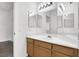 Bathroom featuring a wood vanity, bright lighting and large mirror at 531 Coolidge Ave, Henderson, NV 89015
