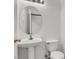 Bright bathroom with a pedestal sink and toilet, perfect for guests at 531 Coolidge Ave, Henderson, NV 89015
