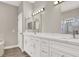 Bright bathroom featuring double vanity with white cabinets and modern fixtures at 531 Coolidge Ave, Henderson, NV 89015