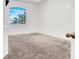 Bright bedroom featuring neutral carpet and a large window offering ample natural light at 531 Coolidge Ave, Henderson, NV 89015