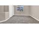 Neutral bedroom featuring plush carpeting, fresh paint, a window, and a built-in closet at 531 Coolidge Ave, Henderson, NV 89015