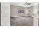 Spacious bedroom with neutral carpeting, a ceiling fan, and bright natural light at 531 Coolidge Ave, Henderson, NV 89015
