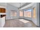 Bright breakfast nook with tile flooring, multiple windows offering natural light, and views of the backyard at 531 Coolidge Ave, Henderson, NV 89015