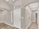 Inviting entryway with high ceilings, neutral colors, and stylish light fixture at 531 Coolidge Ave, Henderson, NV 89015