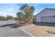 View of a single-story home and a two-car garage, street view featuring well-kept desert landscaping at 531 Coolidge Ave, Henderson, NV 89015