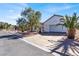 Street view of a well-maintained single-story house featuring desert landscaping and a two-car garage at 531 Coolidge Ave, Henderson, NV 89015