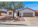 Charming single-story home featuring a two-car garage and low-maintenance desert landscaping at 531 Coolidge Ave, Henderson, NV 89015
