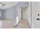 Hallway with neutral tile floors leading to a spacious living area, combining functionality and style at 531 Coolidge Ave, Henderson, NV 89015