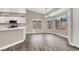 Bright kitchen and dining area featuring white cabinets, wood-look floors and natural light at 531 Coolidge Ave, Henderson, NV 89015