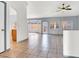 Open living room with tile flooring, large windows, and neutral paint, offering a bright and airy atmosphere at 531 Coolidge Ave, Henderson, NV 89015
