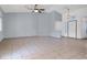 Spacious living room with tile floors, ceiling fan, neutral paint, and an open layout for flexible design options at 531 Coolidge Ave, Henderson, NV 89015
