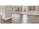 Bright living room featuring wood-look flooring and large windows offering backyard views at 531 Coolidge Ave, Henderson, NV 89015