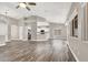 Open concept living space with wood-look flooring, neutral paint, and backyard views at 531 Coolidge Ave, Henderson, NV 89015